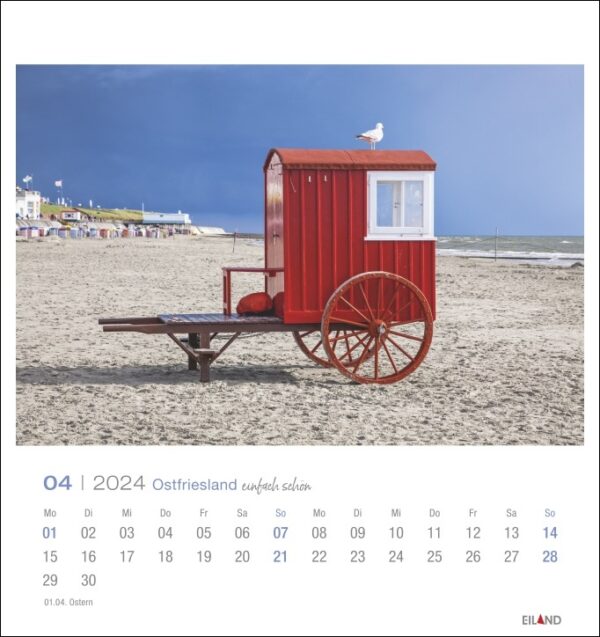 Ein wunderschönes Ostfriesland einfach schön - PostkartenKalender 2024 mit einem roten Karren am atemberaubenden Strand von Ostfriesland.