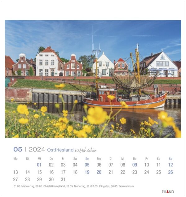 Ein atemberaubender Ostfriesland einfach schön - PostkartenKalender 2024 mit den wunderschönen Landschaften Ostfrieslands, darunter ein malerisches Boot im Hintergrund.