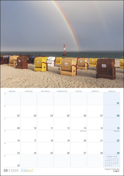 Ein Waterkant 2024 mit einem wunderschönen Regenbogen, der sich über einem ruhigen Strand wölbt.