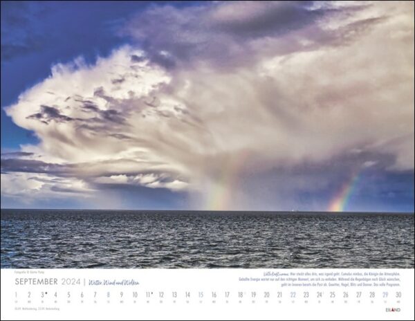 Ein Wetter, Wind und Wolken 2024 mit einem Regenbogen über dem Ozean, der das faszinierende Zusammenspiel von Wind und Wasser einfängt.